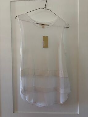 White sleeveless top